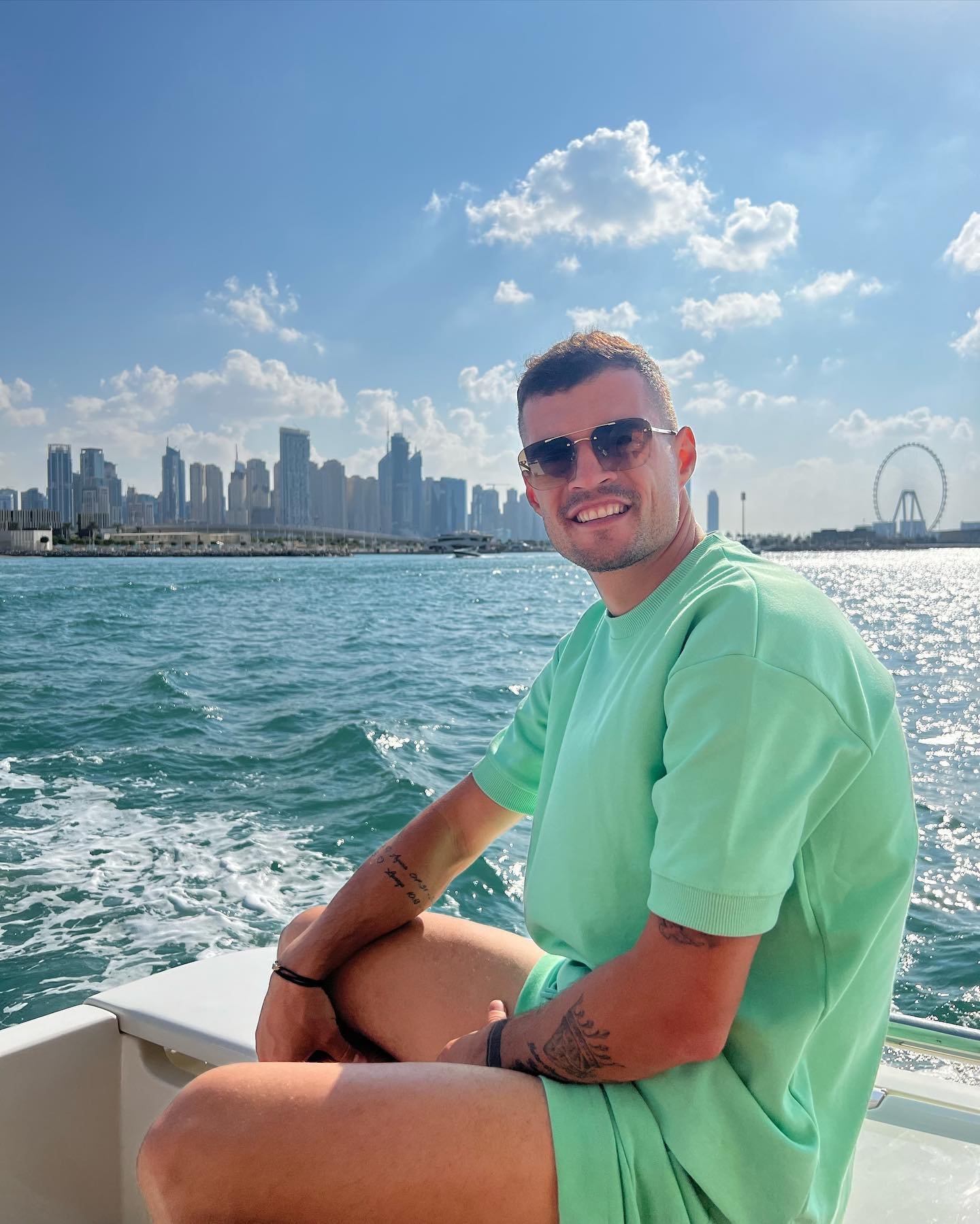 Arsenal star Granit Xhaka unwinds on yacht with wife and child after playing for Switzerland in the World Cup in Qatar (Photos)