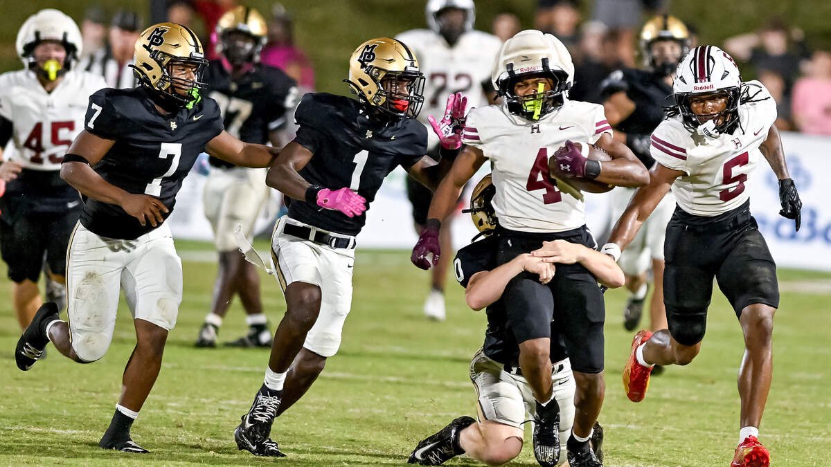 Howard running back Julius Ramsey Jr. (4) is tackled after a reception during the Huskies’ 28-21 overtime loss to Mary Persons Friday night.