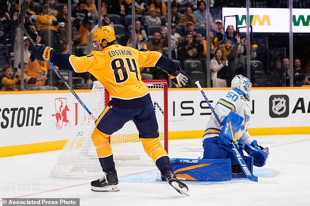 Nashville Predators center Adam Edstrom (84) celebrates his goal against St. Louis Blues goaltender Jordan Binnington (50) during the second period of an NHL hockey game Saturday, Oct. 17, 2026, in Nashville, Tenn. (AP Photo/George Walker IV)