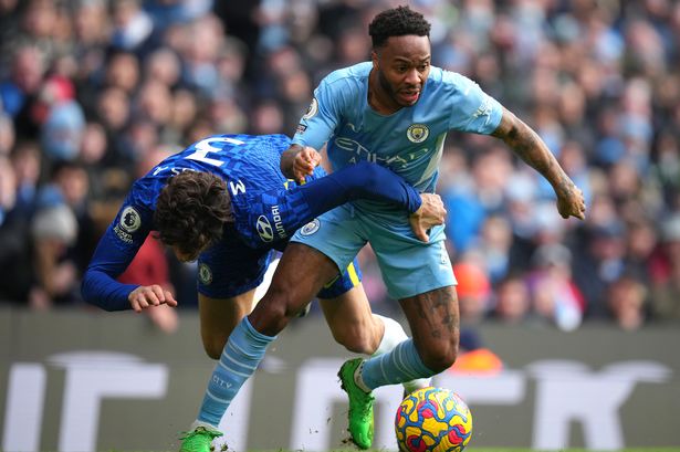 MANCHESTER, ENGLAND - JANUARY 15: Raheem Sterling of Manchester City battles for possession with Marcos Alonso of Chelsea during the Premier League match between Manchester City and Chelsea at Etihad Stadium on January 15, 2022 in Manchester, England.
