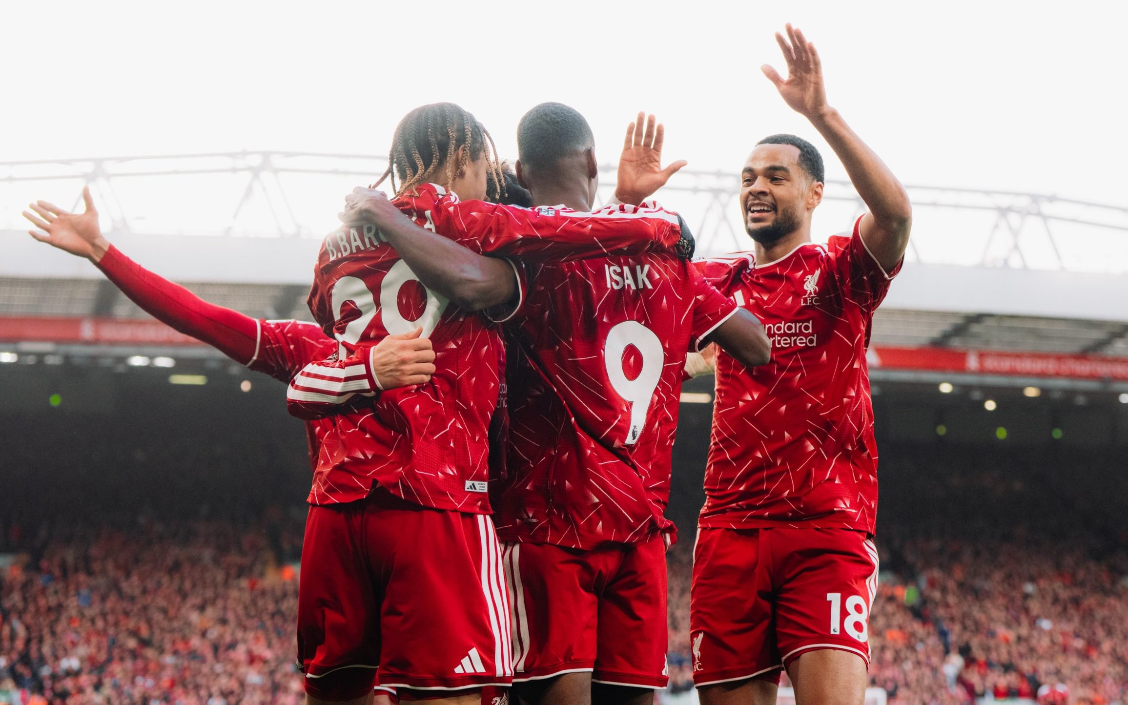 Liverpool players celebrate scoring against Brighton