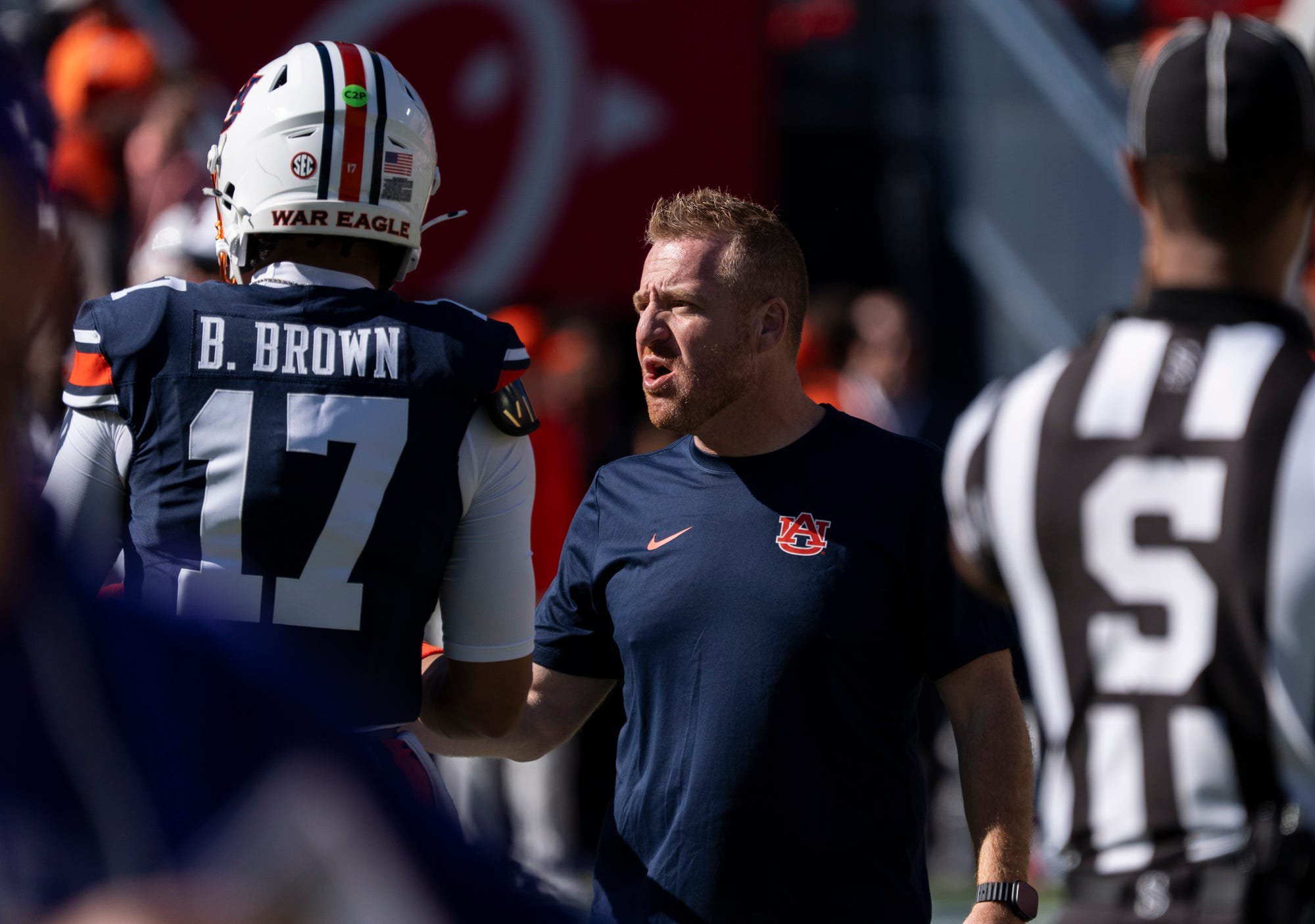 Auburn Tigers head coach Alex Golesh talks with quarterback Byrum Brown (17) during warm ups before Auburn Tigers take on LSU Tigers at Jordan-Hare Stadium in Auburn, Ala. on Saturday, Oct. 24, 2026.