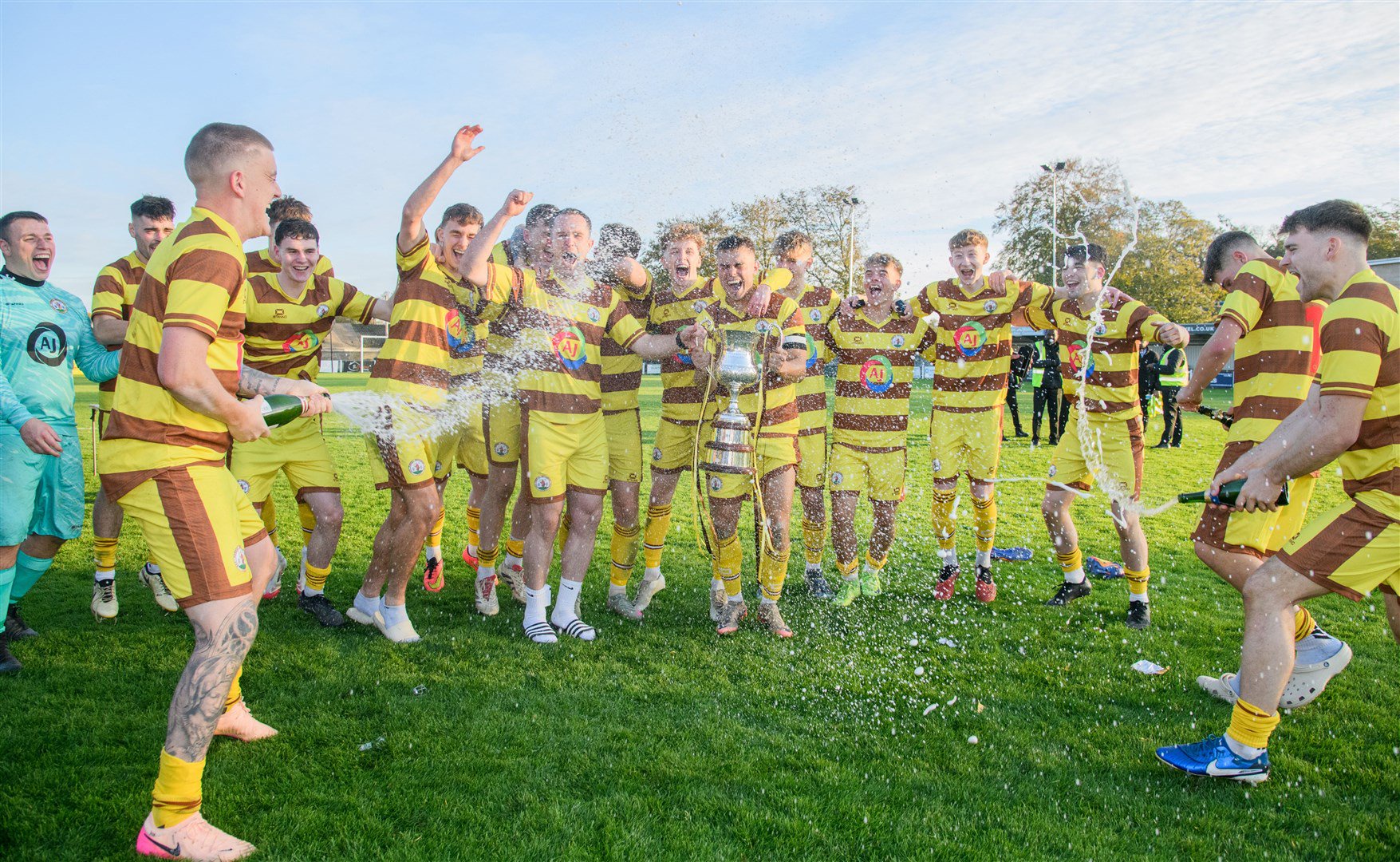 Kieran Hayllar joins Forres Mechanics’ North Cup final celebrations but he didn’t play in the victory over Clach. Picture: Daniel Forsyth.