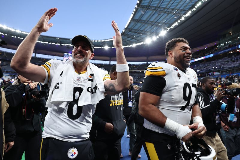 Aaron Rodgers and Cameron Heyward of the Pittsburgh Steelers celebrate after the NFL game against New Orleans Saints. Photograph: Catherine Steenkeste/Getty