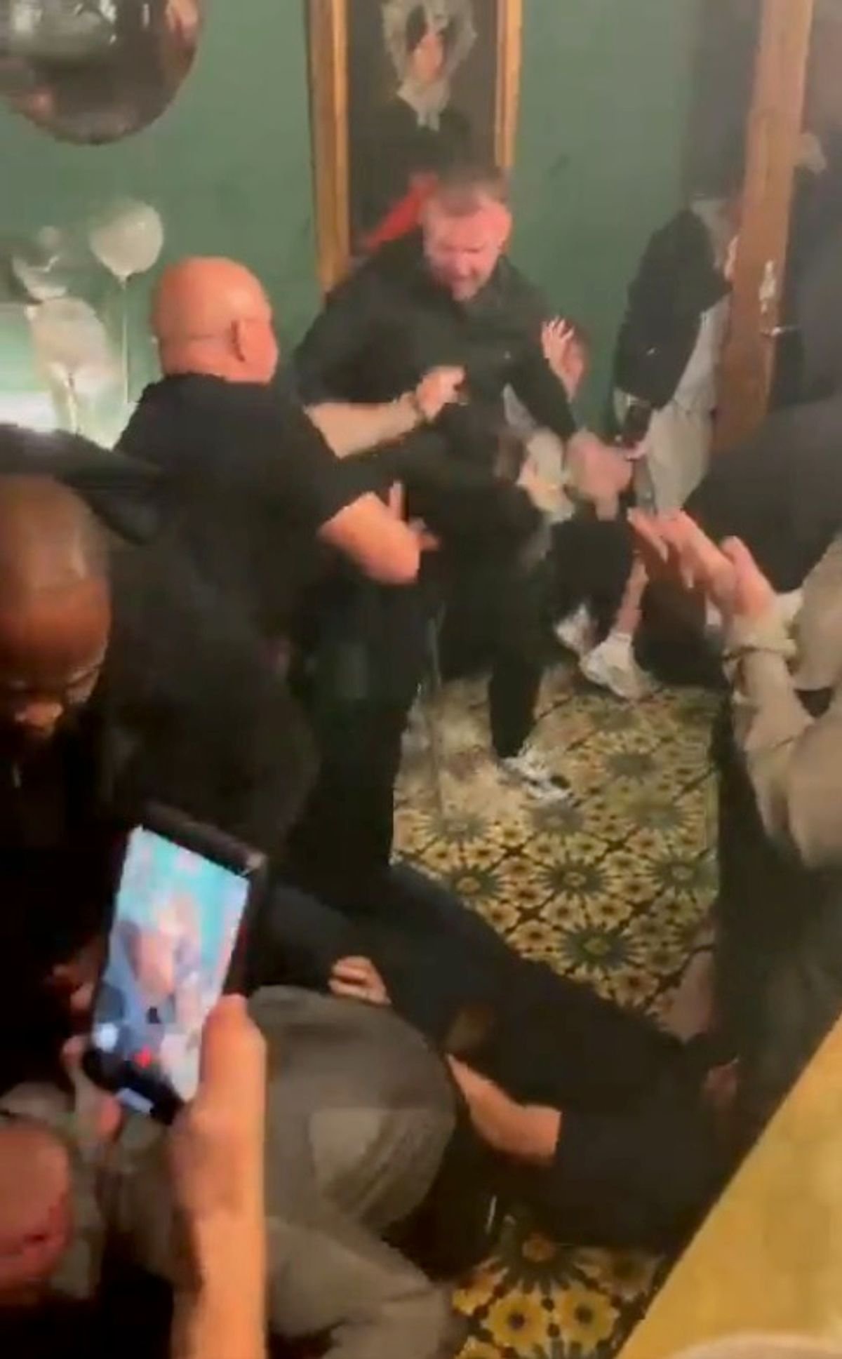 Man Utd fans were brawling in a bar - with one fan left with a busted lip