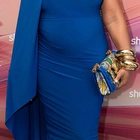 Ashanti, 43, is seen for the FIRST time since announcing her pregnancy as she shows off her baby bump in form-fitting dress at POSSIBLE event in Miami