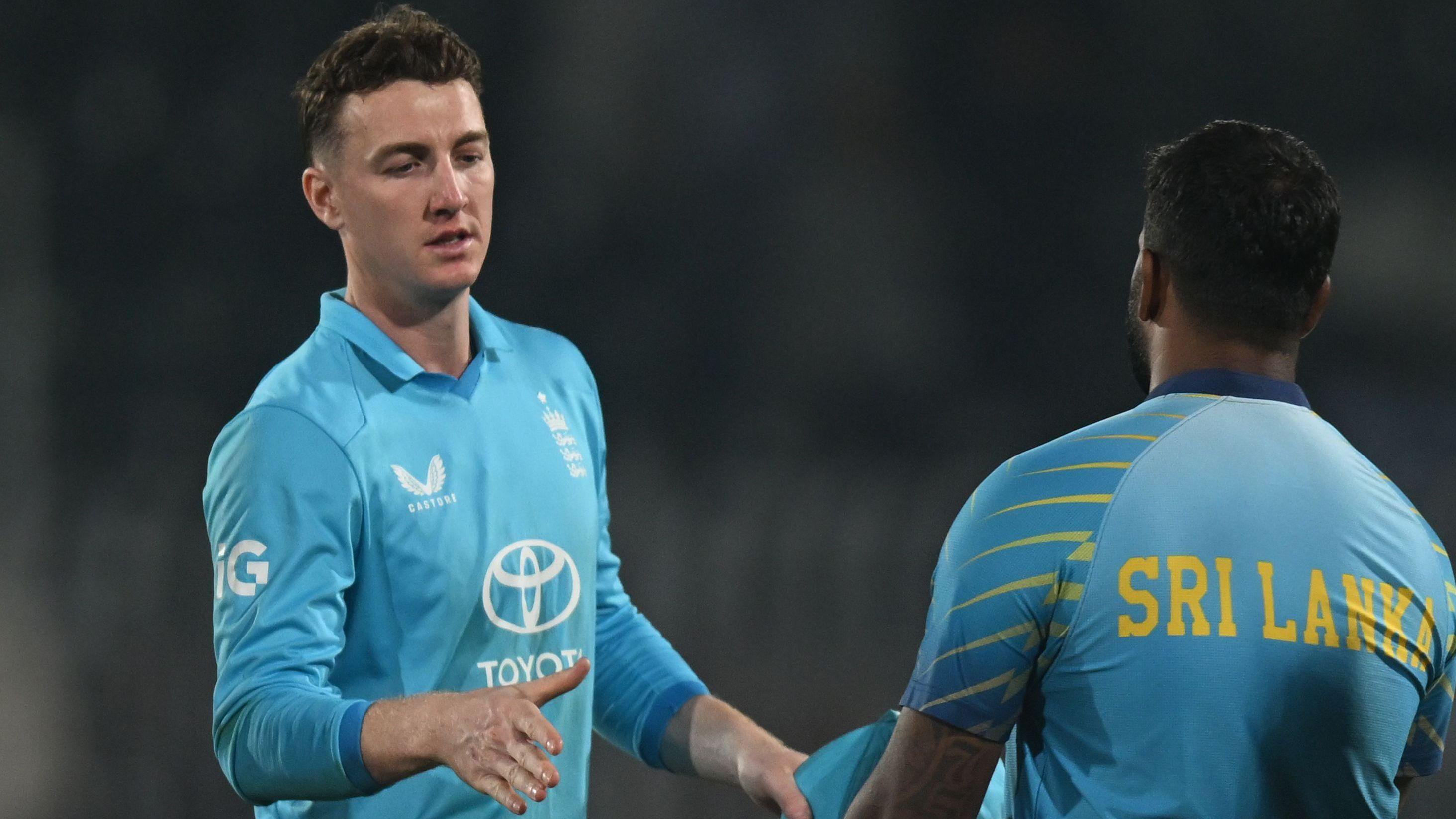Harry Brook and Kusal Mendis shake hands