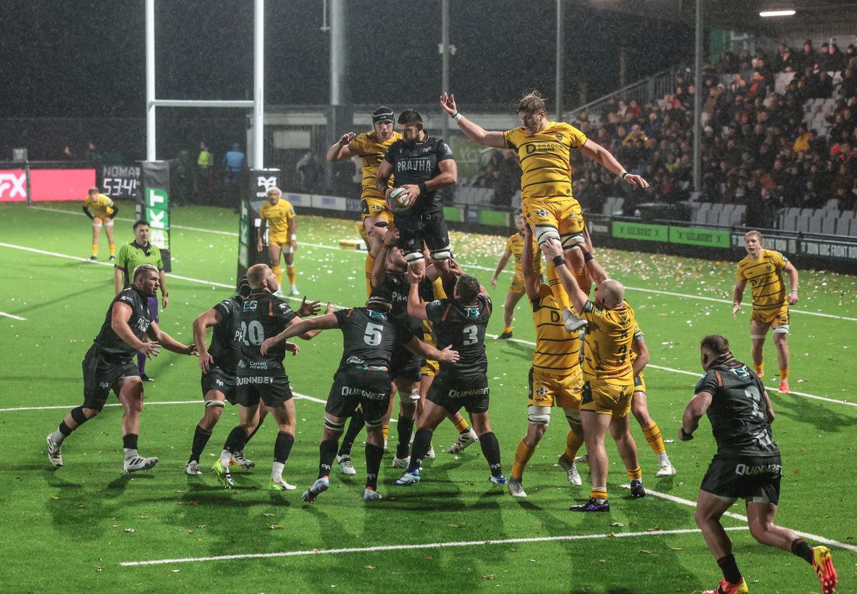 Liam Wright of the Ospreys takes the ball in the lineout