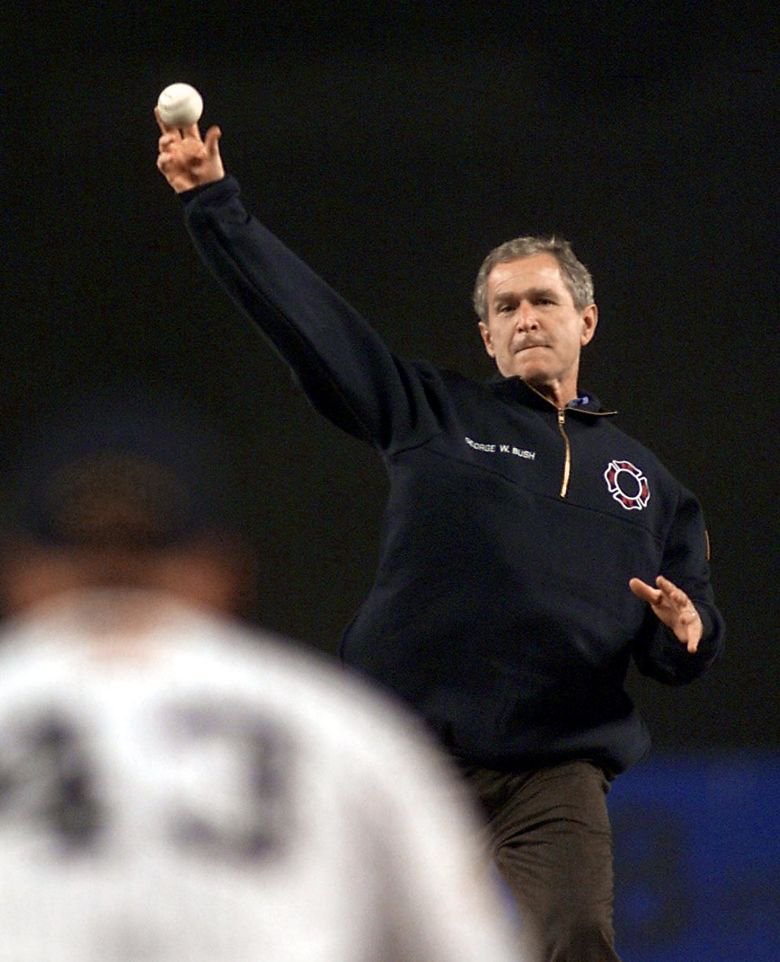 Bush hurls the ceremonial first pitch during Game 3 of the 2001 World Series.