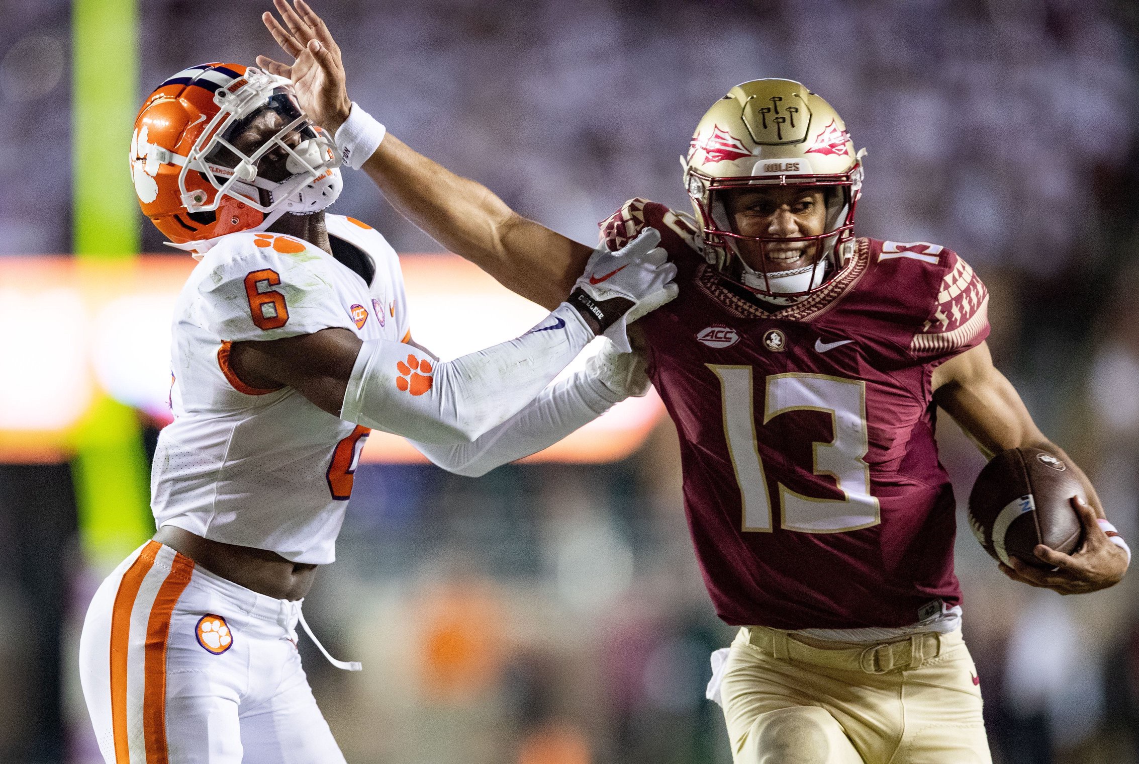 Florida State Seminoles quarterback Jordan Travis (13) stiff arms Clemson Tigers cornerback Sheridan Jones (6).The Clemson Tigers defeated the Florida State Seminoles 34-28 at Doak Campbell Stadium on Saturday, Oct. 15, 2022.

Fsu V Clemson First536