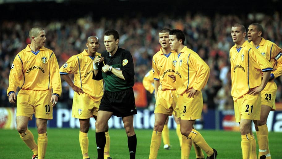 8 May 2001:  The Leeds player surround the referee Urs Meier after Juan Sachez scored a controversial goal during the match between Valencia and Leeds United in the UEFA <a class=
