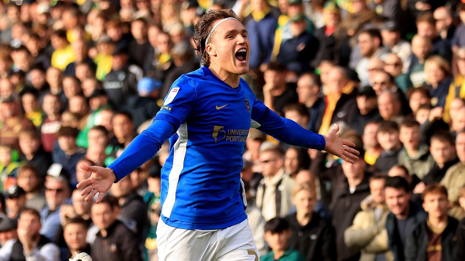 Marko Milovanovic runs with his arms spread wide after scoring for Portsmouth