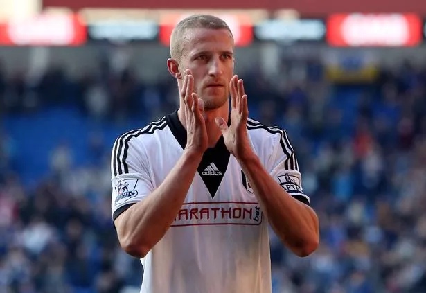Fulham's US-born Norwegian defender and captain Brede Hangeland applauds supporters following the final whistle of the English Premier League football match between Cardiff City and Fulham at Cardiff City Stadium in Cardiff, south Wales on March 8, 2014.