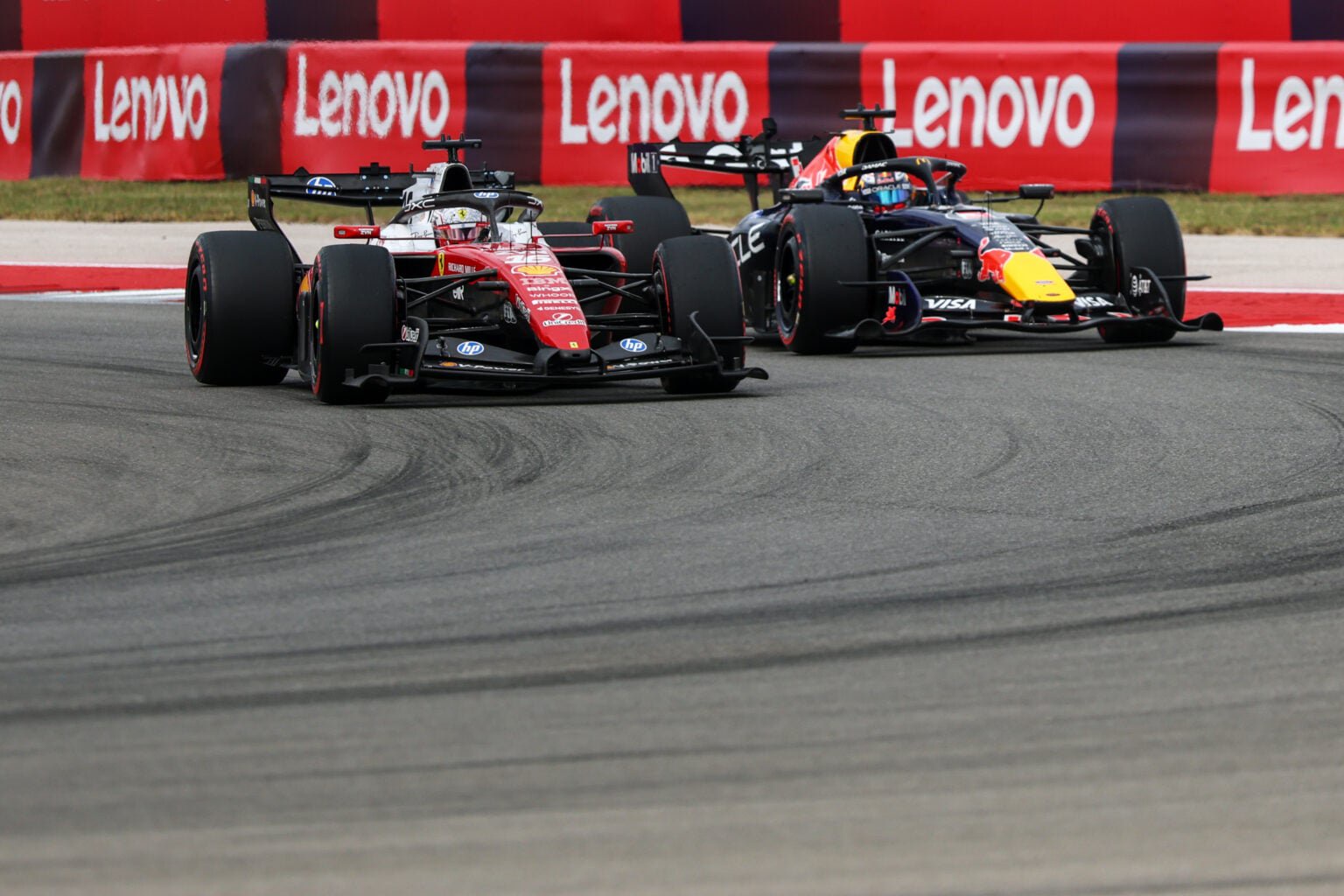 Ferrari driver Charles Leclerc battles Red Bull's Max Verstappen on track during the 2026 F1 United States Grand Prix