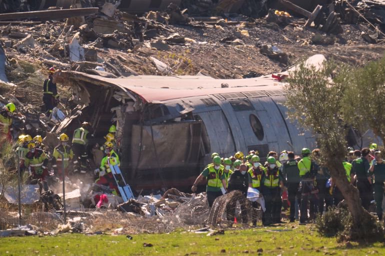 Emergency services attend to the victims at the scene of a collision between two trains in Urda, Spain, on Wednesday, Oct. 28, 2026. (AP Photo/Manu Fernandez)