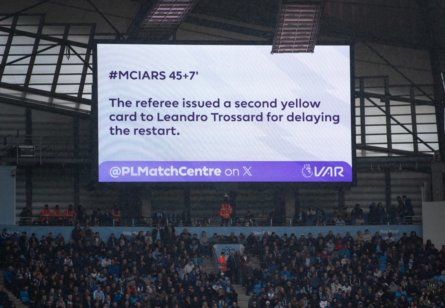 The electronic scoreboard explains the sending off of Leandro Trossard due to a second yellow card for delaying the restart during the Premier Leag...