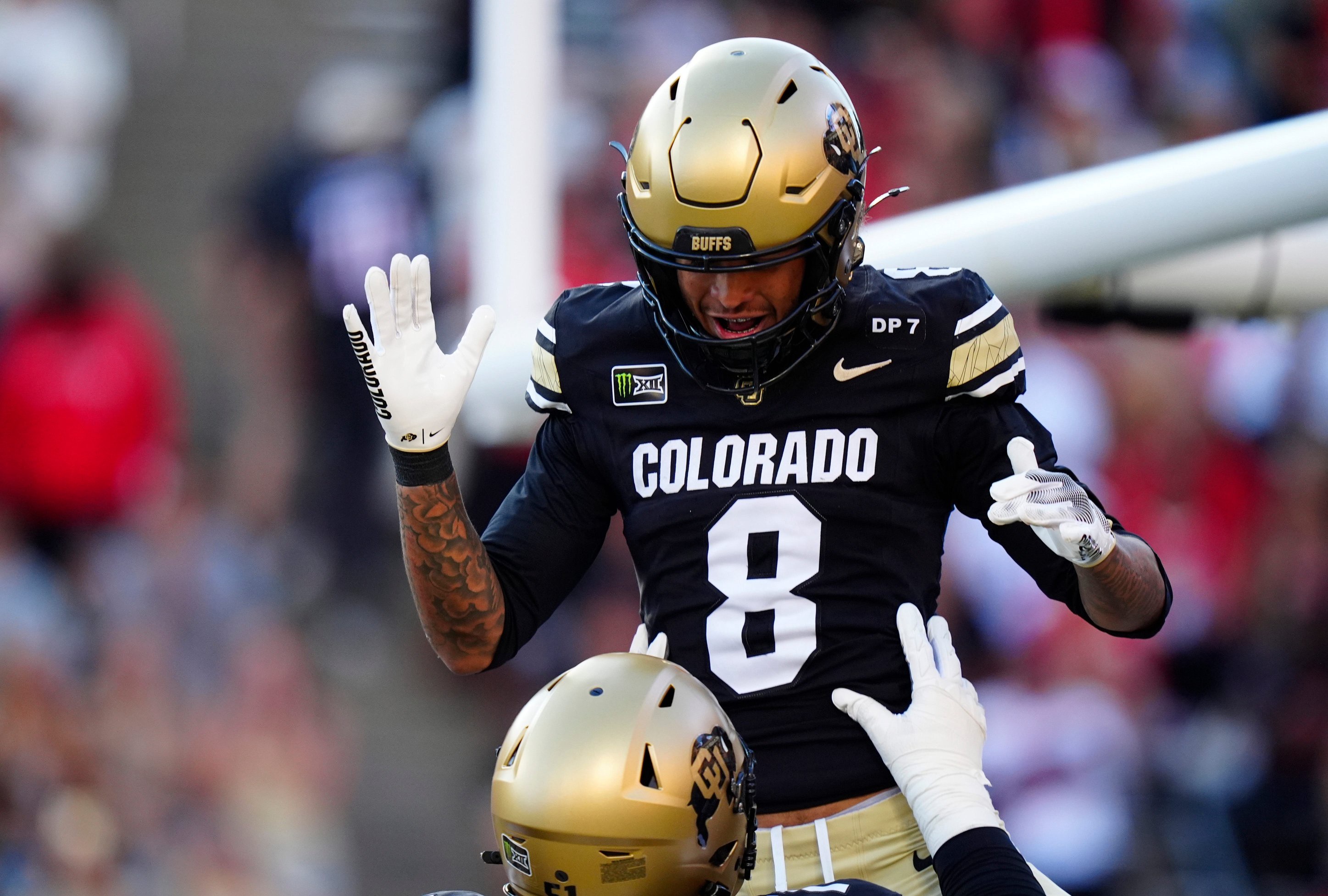 Oct 3, 2026; Boulder, Colorado, USA;  Colorado Buffaloes offensive lineman Chauncey Gooden (51) lifts wide receiver Joseph Williams (8) following his touchdown reception in the first quarter against the Texas Tech Red Raiders at Folsom Field.  Mandatory Credit: Ron Chenoy-Imagn Images