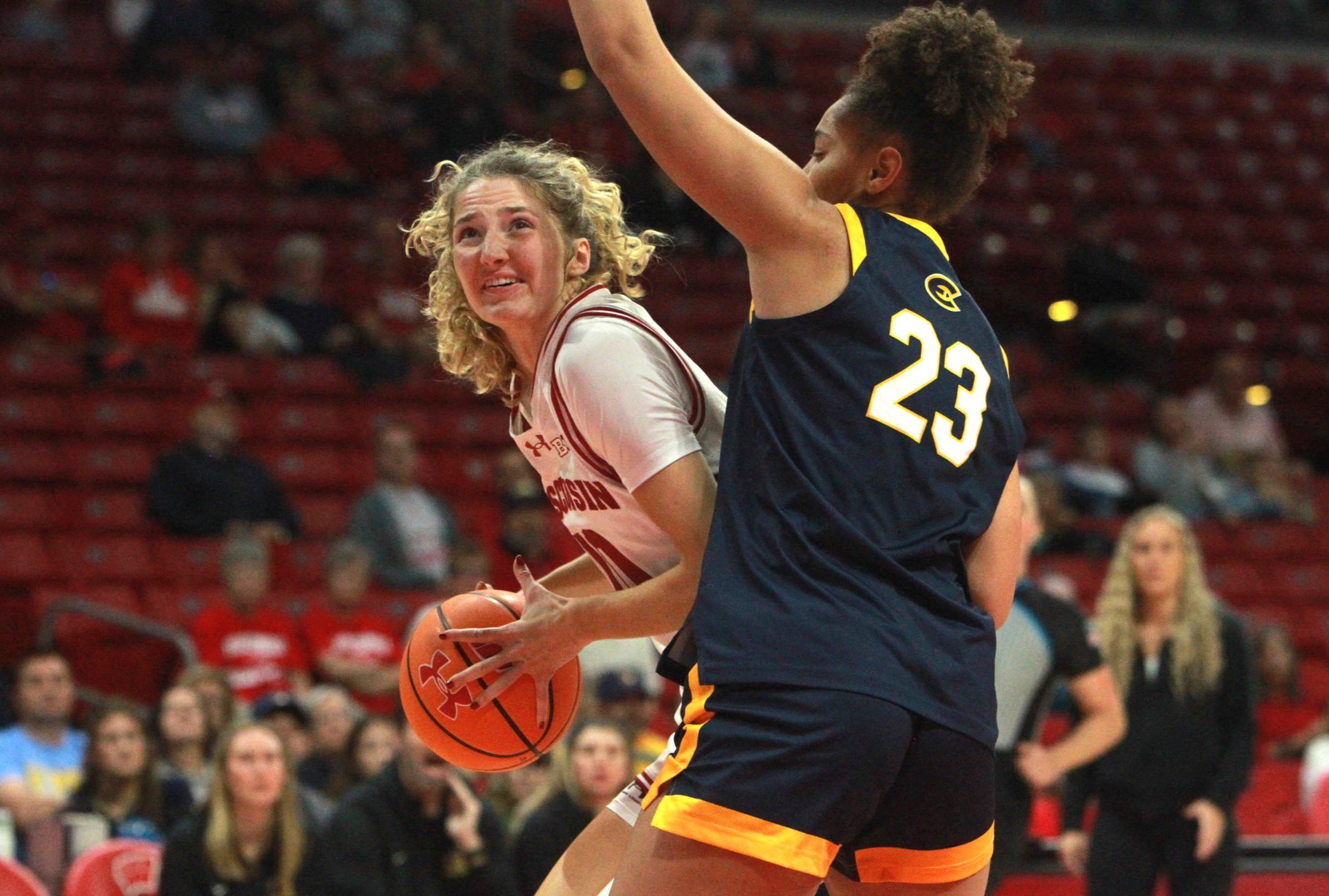 Wisconsin's Adaline Sheplee eyes the basket as UW-Eau Claire's Brooklyn Birt defends during the first half of an exhibition game at the Kohl Center in Madison, Wisconsin on Oct. 28, 2026.