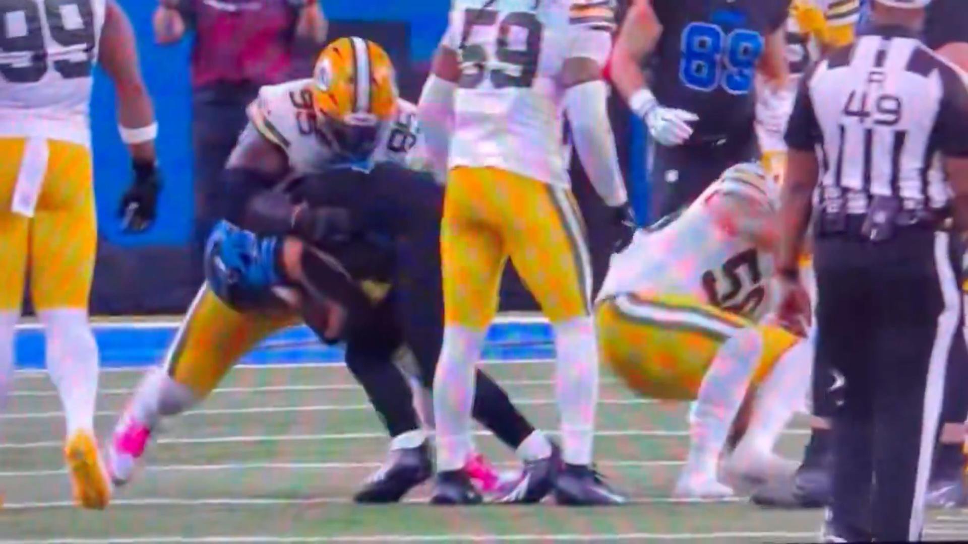 Green Bay Packers players during a controversial penalty play on the field.