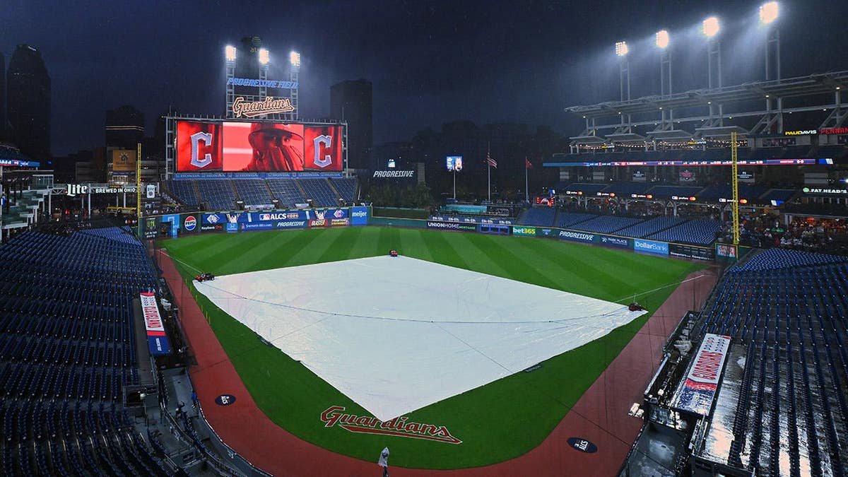 Tarp covers the field at Progressive Field before Game 4 of the ALCS.