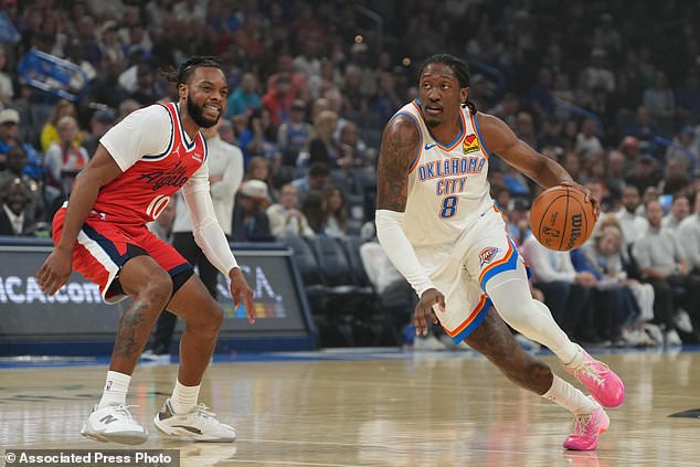 Oklahoma City Thunder guard Jalen Williams (8) drives past Los Angeles Clippers guard Darius Garland (10) during the first half of an NBA basketball game, Sunday, Oct. 25, 2026, in Oklahoma City. (AP Photo/Kyle Phillips)