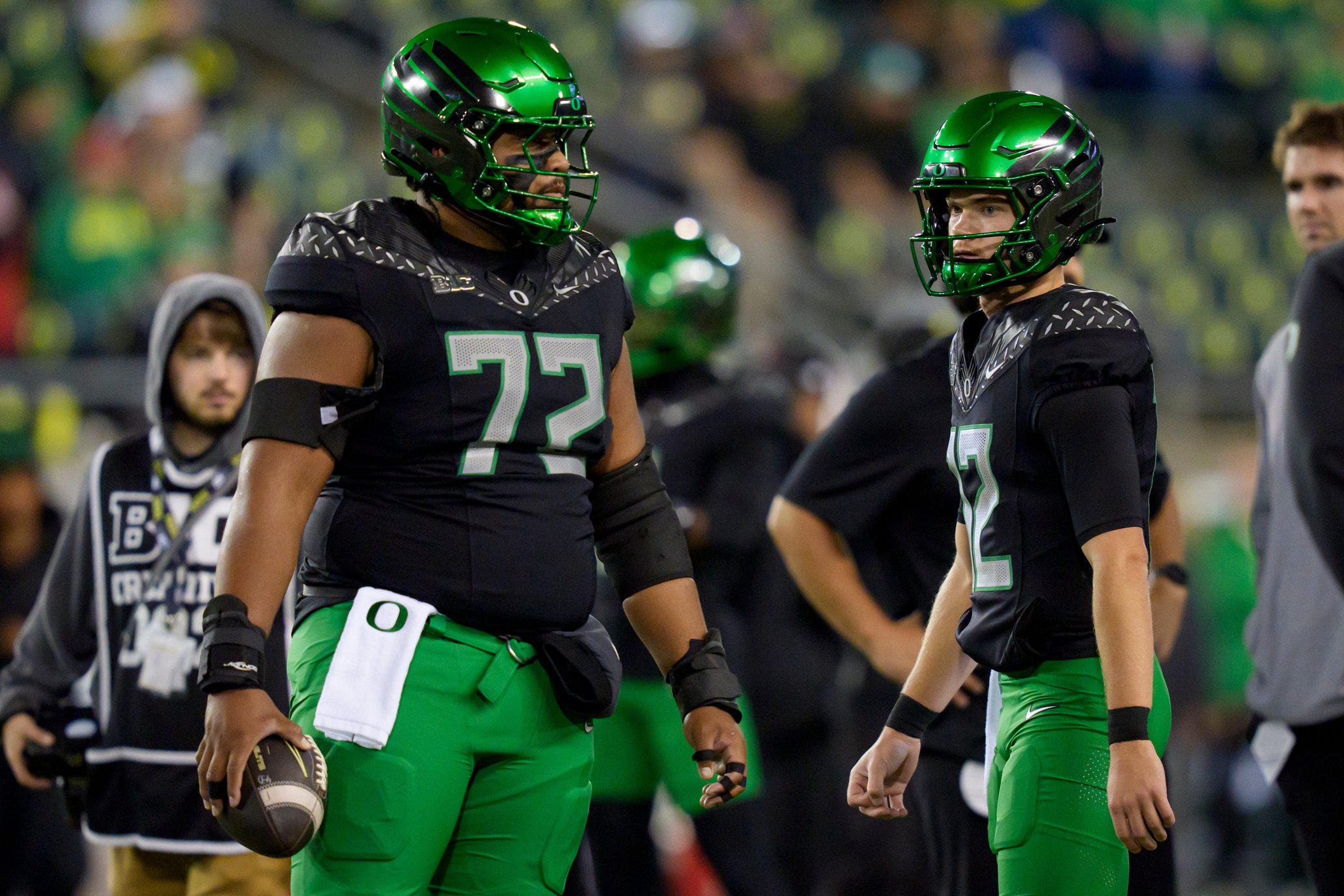 Oregon Ducks quarterback Brock Thomas, right, talks with Oregon Ducks offensive lineman Iapani Laloulu before the game as the Oregon Ducks host the Nebraska Cornhuskers on Oct. 17, 2026, at Autzen Stadium in Eugene, Oregon.
