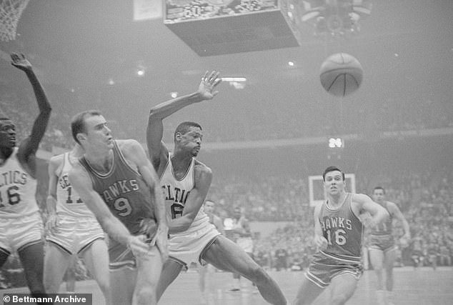 Hagan (No. 16) is seen behind Bill Russell, the Celtics star for whom he was famously traded