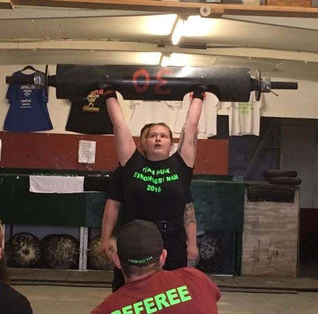Shauna competing in the log press (40kg) at her first competition in 2016.