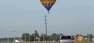 Hot air balloon struck Indiana power lines, burning three people in basket
