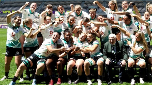 23 October 2026; The Ireland team and IRFU president Tony O'Beirne react to the mark the 50th cap for Neve Jones, as they pose for a squad photo at their captain's run at Athlone Stadium in Cape Town, South Africa. Photo by Shaun Roy/Sportsfile