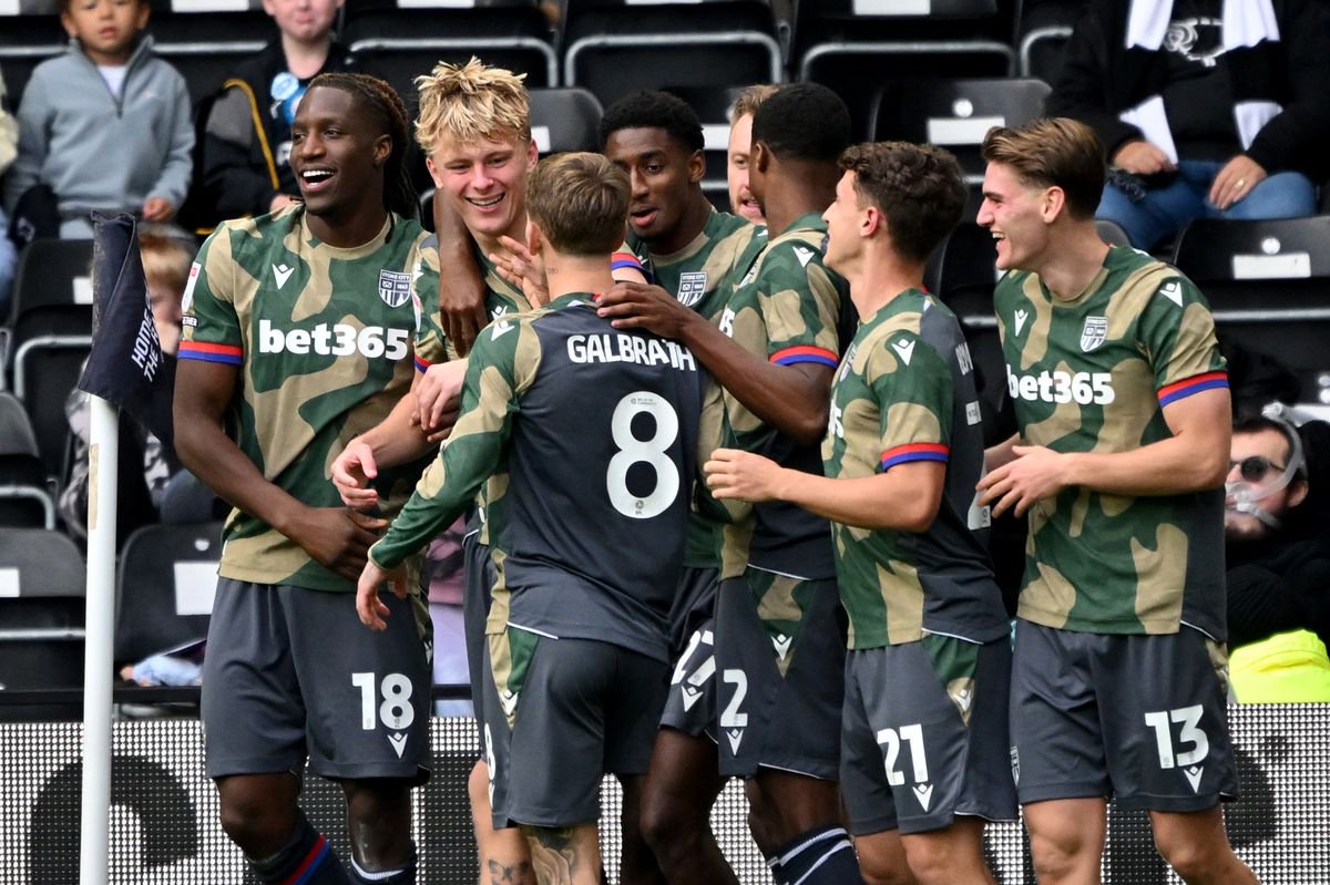 Stoke City's Luke Graham (second left) celebrates after scoring