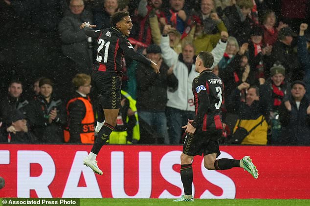 Bournemouth's Amine Adli, left, celebrates after scoring his side's third goal during the Europa League soccer match between Bournemouth and AC Milan in Bournemouth, England, Thursday, Oct. 22, 2026. (AP Photo/Alastair Grant)