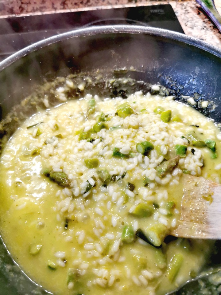 Making asparagus risotto.