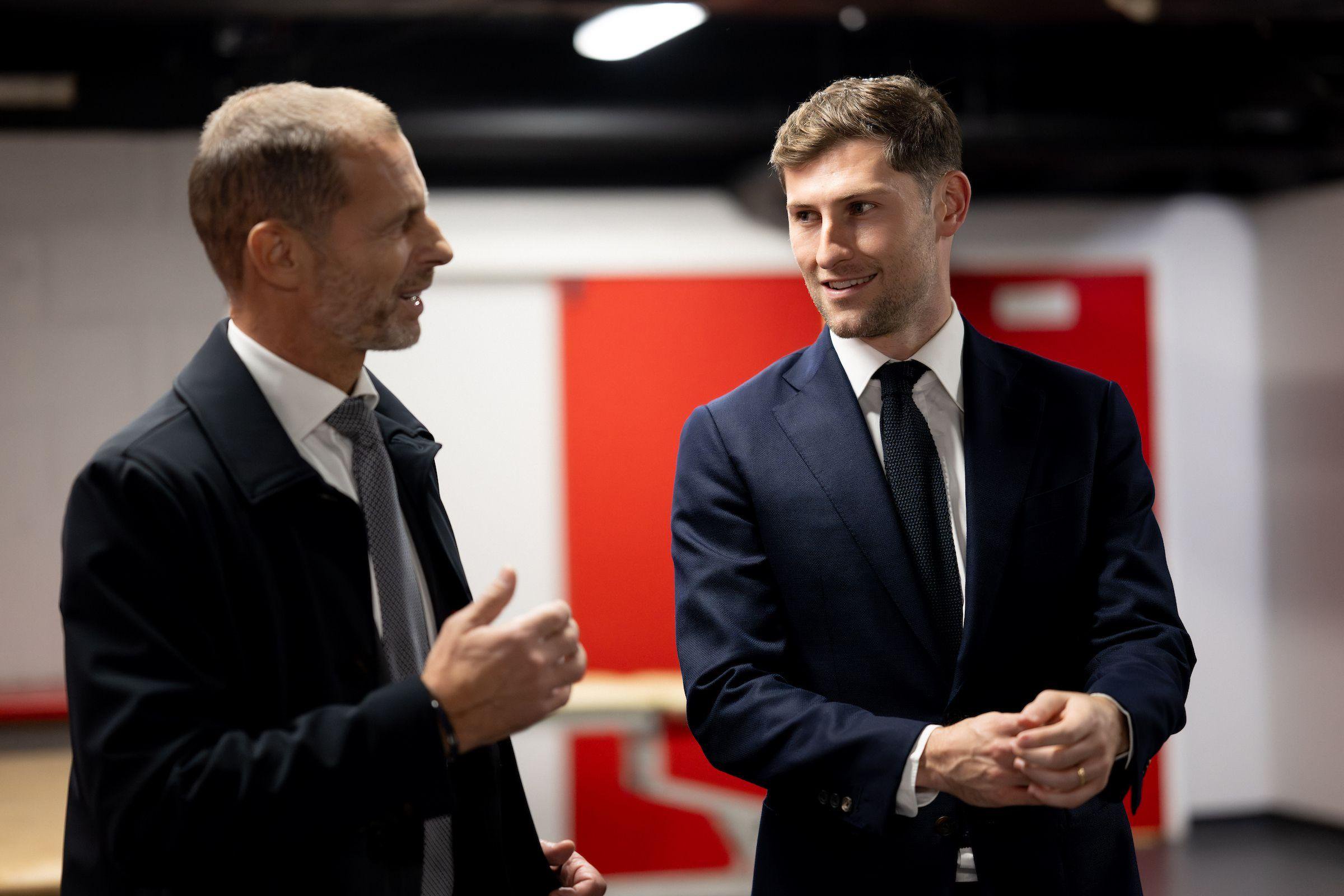 Ben Davies (left) pictured alongside Uefa president Aleksander Ceferin at the FAW's headquarters in Hensol
