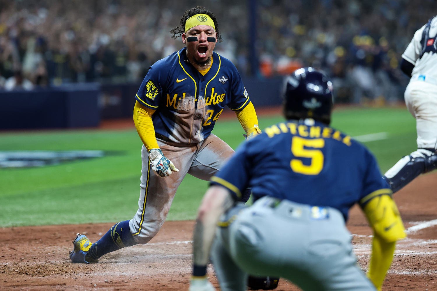 William Contreras #24 of the Milwaukee Brewers reacts after scoring. (Rob Tringali / MLB Photos via Getty)