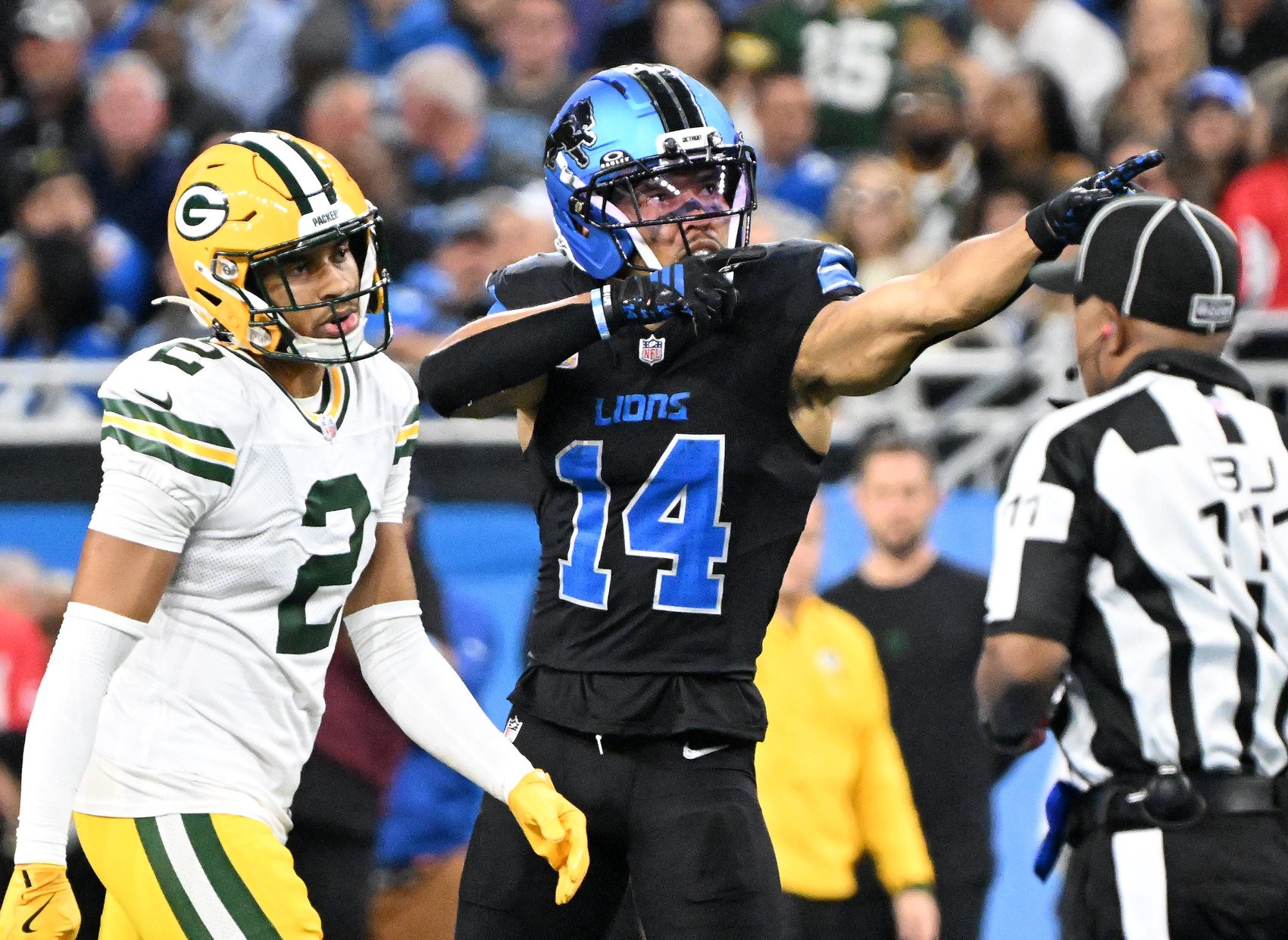 Lions wide receiver Amon-Ra St. Brown (14) signals a first down in the third quarter. Detroit Lions take on the Green Bay Packers on Oct. 25, 2026 at Ford Field in Detroit.