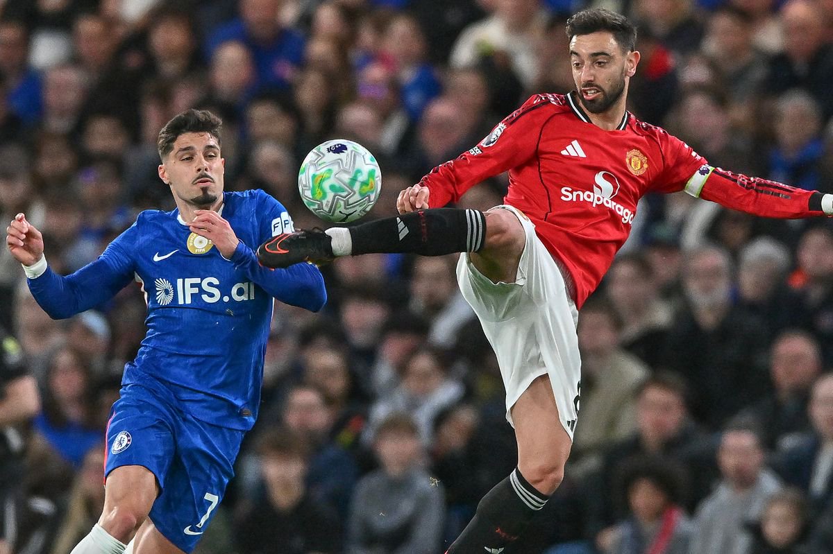 Bruno Fernandes of Manchester United and Pedro Neto of Chelsea battle for the ball during the Premier League match between Chelsea and Manchester United