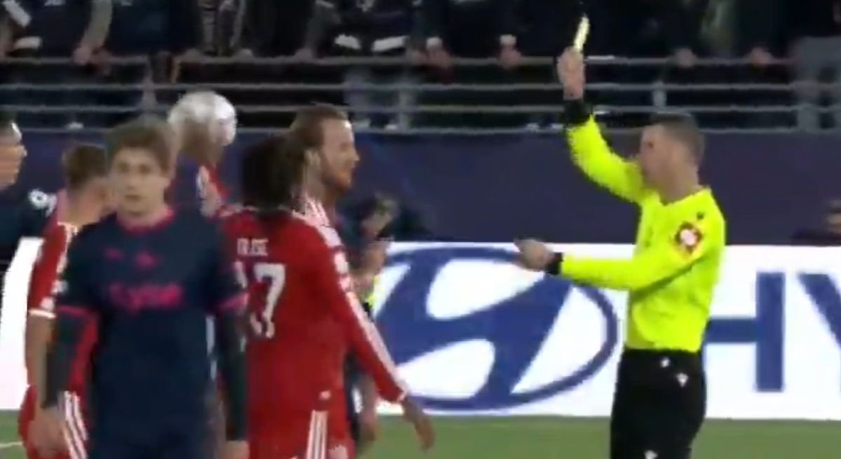 Michael Olise throws the ball at an opponent's face