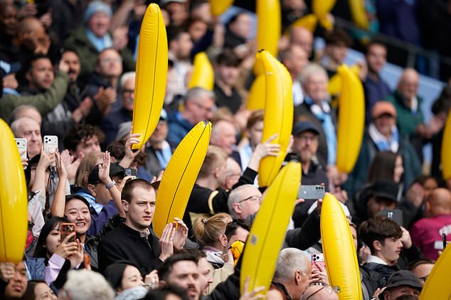 Manchester City fans wave inflatable bananas during the English Premier League soccer match between Manchester City and Ipswich Town, in Manchester, England, Saturday, Oct.17, 2026. (AP Photo/Dave Thompson)