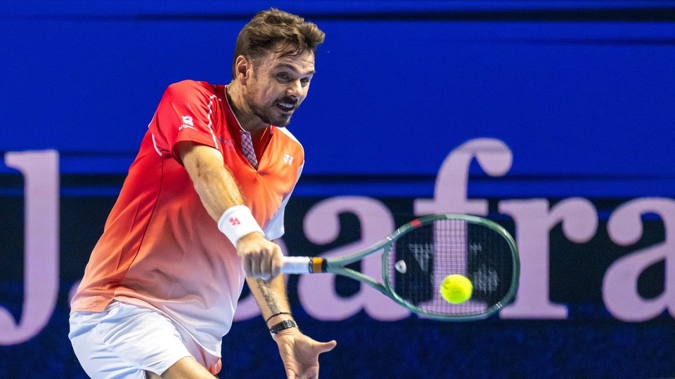 Switzerland's Stan Wawrinka returns a shot to Czech Republic's Jiri Lehecka during the first round of the Swiss Indoors tennis tournament in Basel (Georgios Kefalas/Keystone via AP)