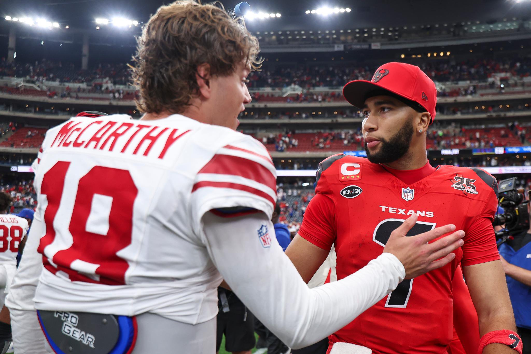Houston Texans quarterback C.J. Stroud (7) greets New York Giants quarterback J.J. McCarthy (18) after a game at Reliant Stadium in Houston, Texas, Sunday, Oct. 25, 2026.
