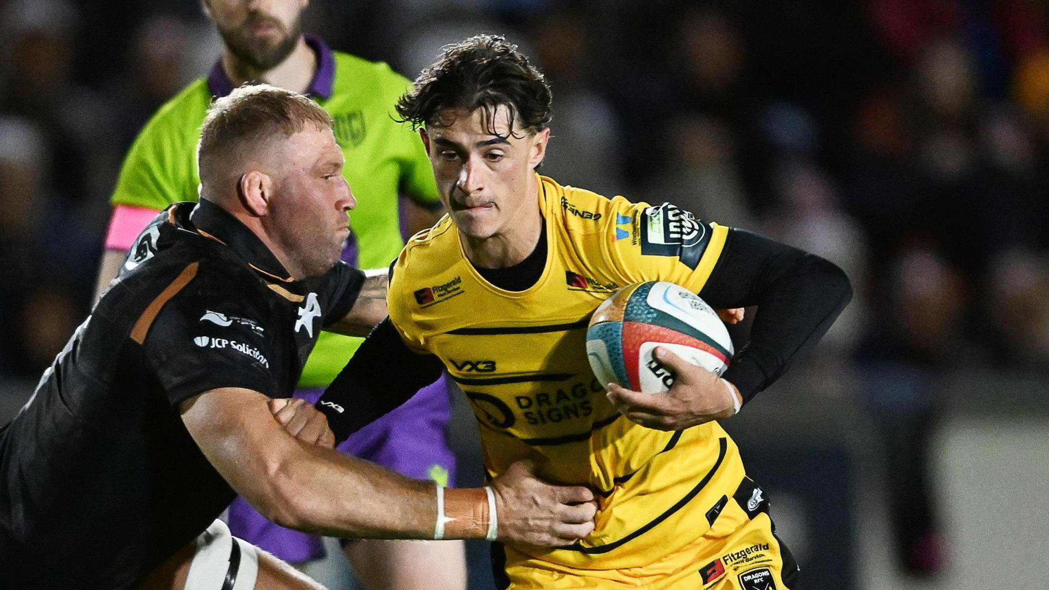 Che Hope carries the ball for Dragons against Ospreys