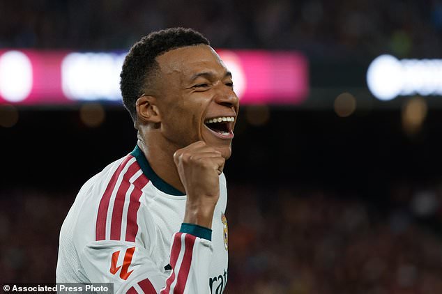 Real Madrid's Kylian Mbappe celebrates after scoring his side's opening goal during a Spanish La Liga soccer match between FC Barcelona and Real Madrid in Barcelona, Spain, Sunday, Oct. 25, 2026. (AP Photo/Joan Monfort)