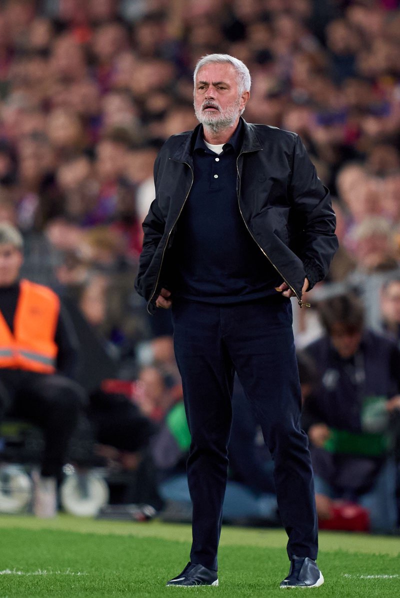 Image may contain Jos Mourinho ابو خليل People Person Adult Clothing Coat Standing and Child