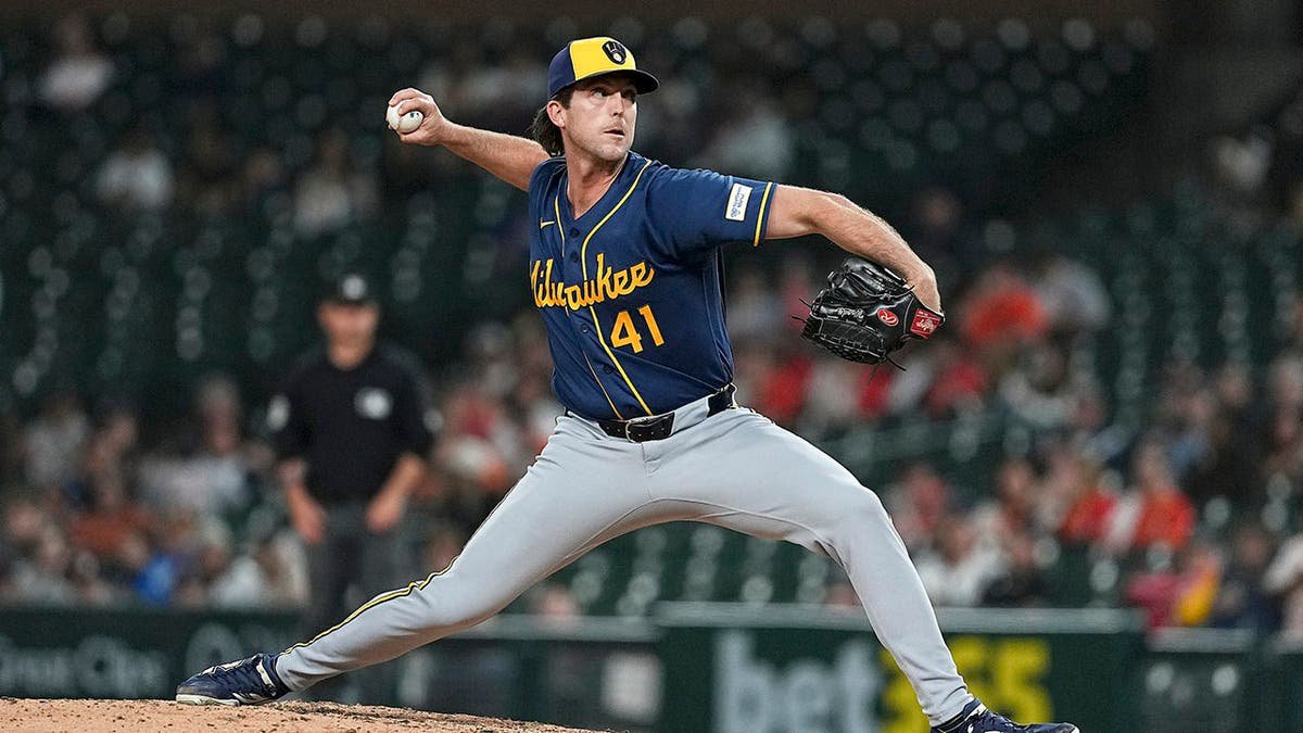 Jake Woodford pitches for the Milwaukee Brewers during a game against the Detroit Tigers.