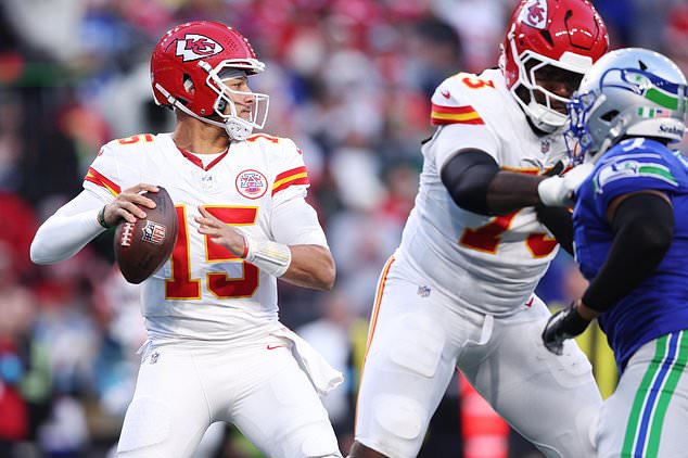 Kansas City Chiefs quarterback Patrick Mahomes looks to throw during the first half of an NFL football game against the Seattle Seahawks in Seattle, Sunday, Oct. 25, 2026. (AP Photo/Kevin Ng)