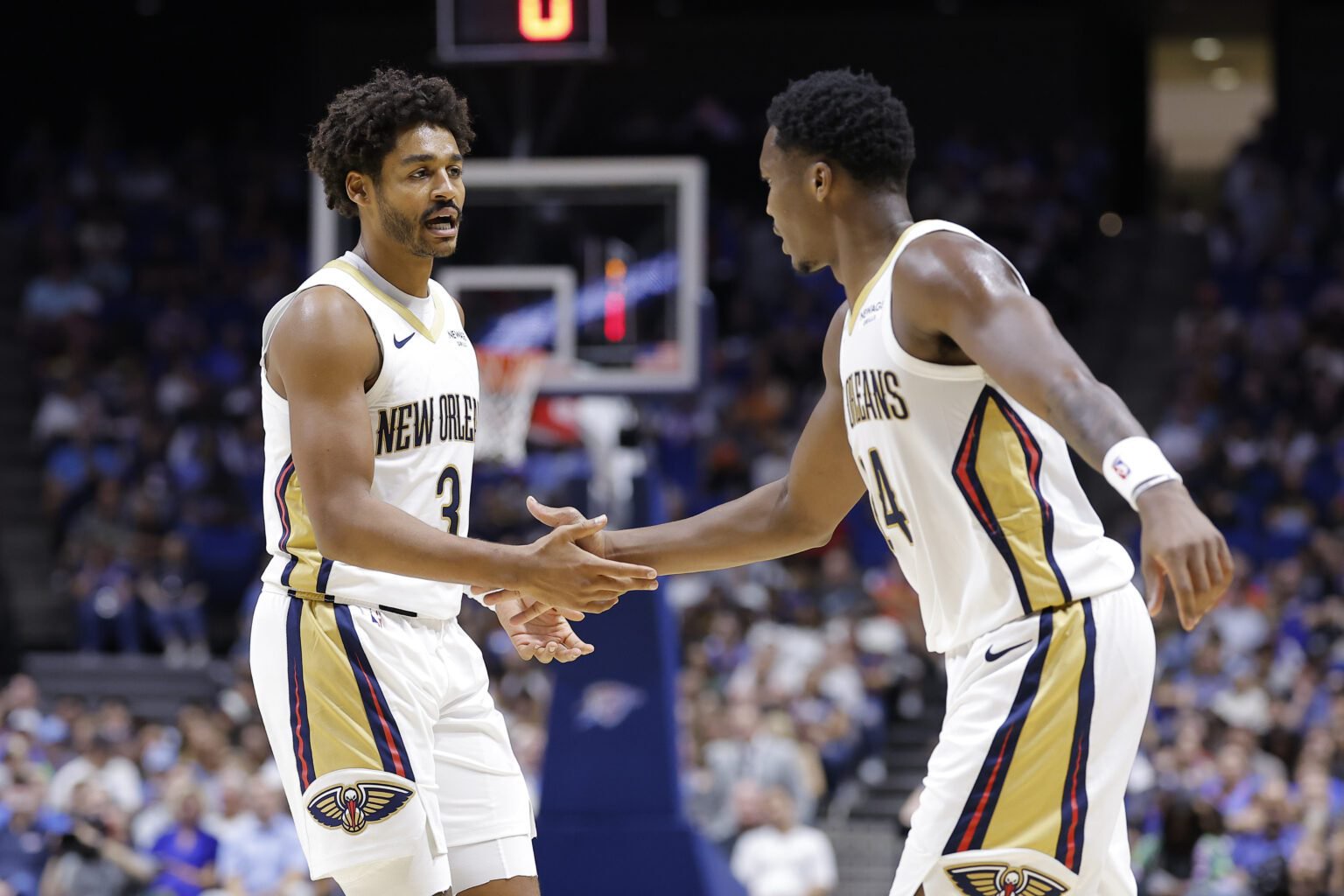 Oct 6, 2026; Tulsa, Oklahoma, USA; New Orleans Pelicans guard Jordan Poole (3) and guard/forward Bennedict Mathurin (24) celebrate after a play against the Oklahoma City Thunder during the first half at BOK Center. Mandatory Credit: Alonzo Adams-Imagn Images