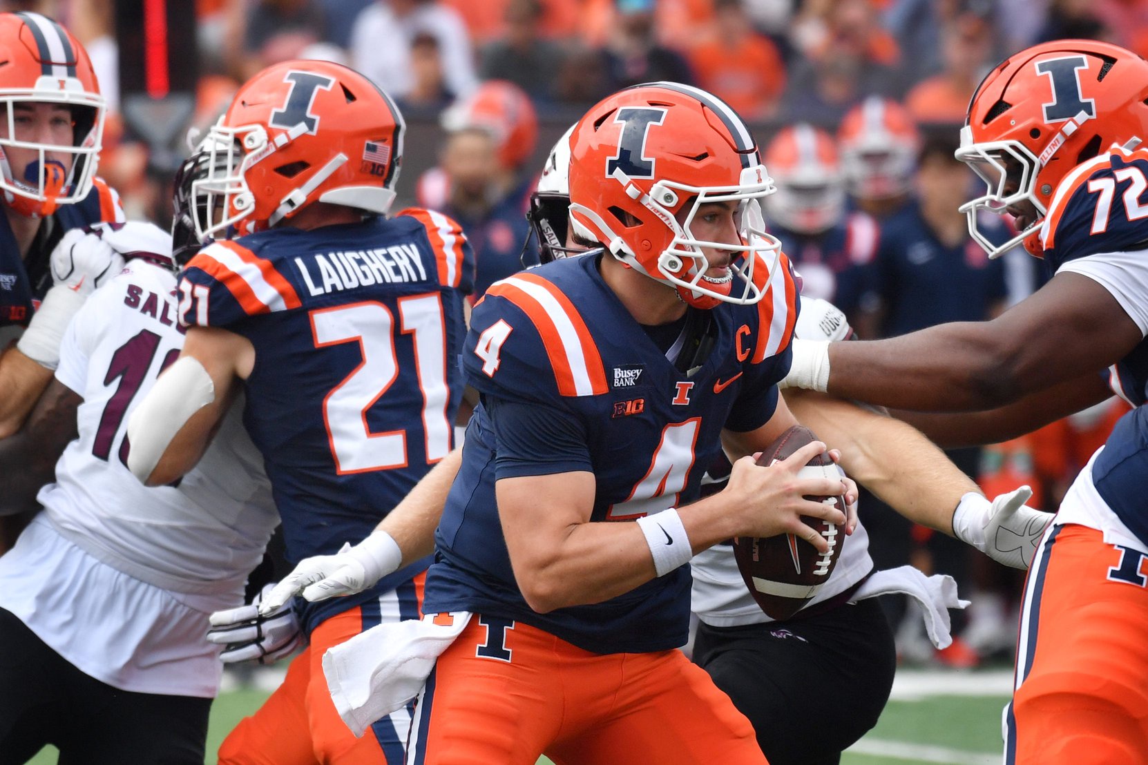 Illinois Fighting Illini quarterback Katin Houser (4) runs the ball during the first half against the Southern Illinois Salukis at Gies Memorial Stadium.