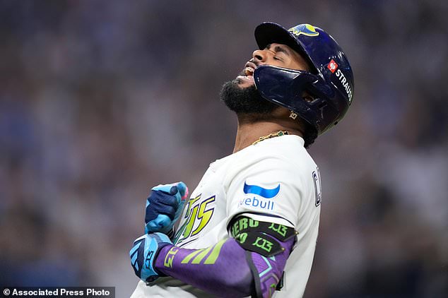 Tampa Bay Rays' Junior Caminero celebrates a two-run home run against the Cleveland Guardians during the seventh inning in Game 6 of an American League Championship Series baseball game in St. Petersburg, Fla. Monday, Oct. 19, 2026. (AP Photo/David J. Phillip)