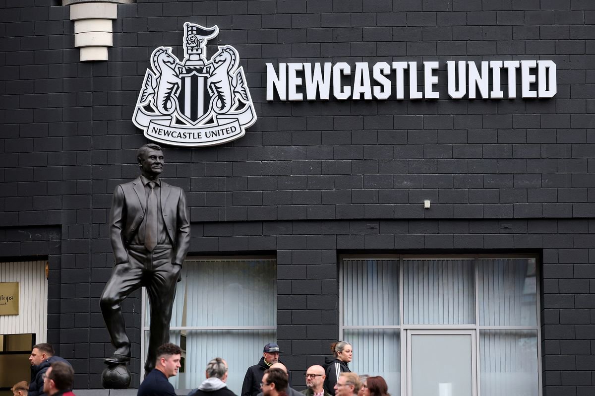 The new Newcastle United branding at St James' Park, by the Sir Bobby Robson statue